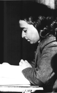 Yogananda reading a book on a train (date unknown).